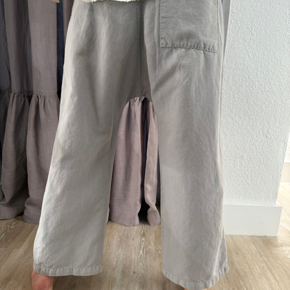 
                  
                    PLEATED GREY CROP PANT
                  
                