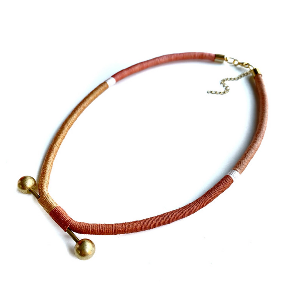 
                  
                    BRASS BALL NECKLACE
                  
                